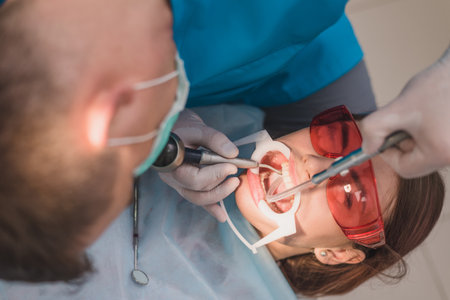 doctor performs the procedure for cleaning teethの写真素材
