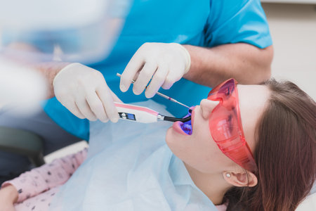 doctor examines the patient after brushing his teethの写真素材