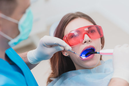 doctor examines the patient after brushing his teethの写真素材