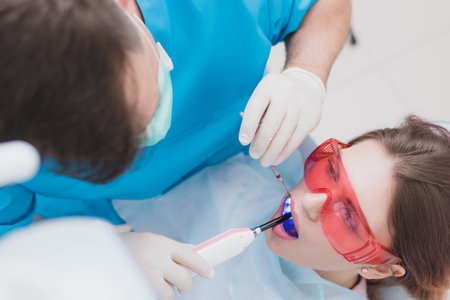 doctor examines the patient after brushing his teethの写真素材