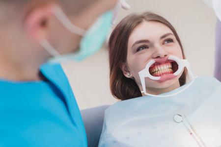 doctor performs the procedure for cleaning teethの写真素材