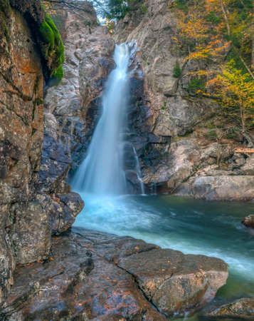 Autumn at the Swift river in New Hampshire large waterfall with rocksの写真素材