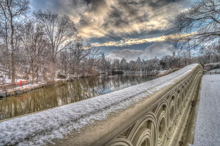 Bow bridge, Central Park, New York City, after snow storm in the early morningの写真素材