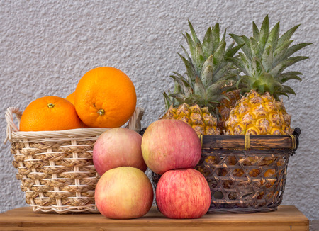Fresh fruit apples oranges and pineapples.の写真素材