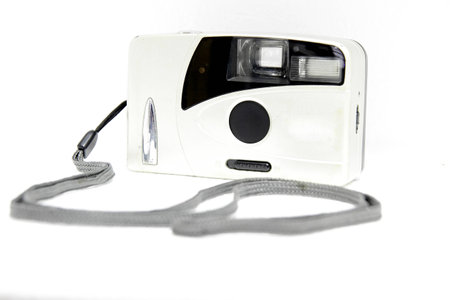 Front of retro camera in white isolated backgroundの写真素材