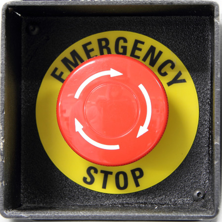 Red button with emergency stop wordの写真素材