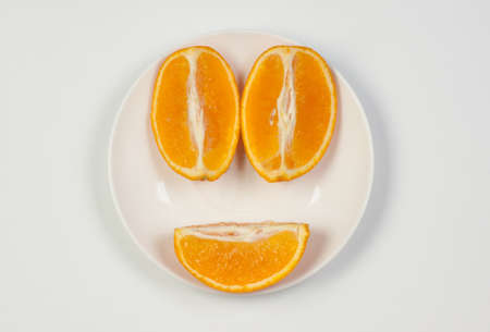 Orange on a plate, cutの写真素材