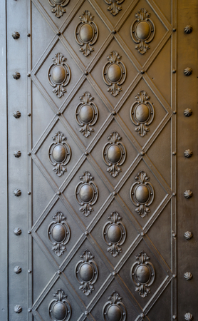 Embossed pattern on a bronze door panelの写真素材