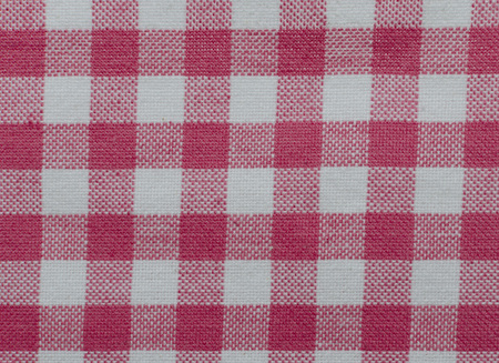 Material for a tea towel or table cloth with a checkered red and white patternの写真素材