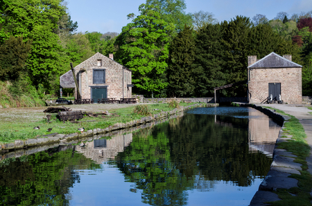 Old buildings at the side of Cromford Canal in the Peak District, Derbyshireの写真素材