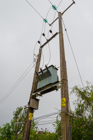 Electricity transformer outdoor mounted on wooden supporting frame