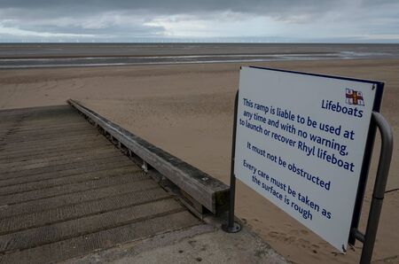Rhyl, UK: Jan 7, 2020:A sign warns people to keep clear of the Rhyl lifeboat launching ramp.のeditorial素材