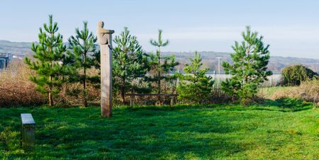 Greenfield, Flintshire, UK: Feb 6, 2020: The Lookout is a carved wood sculpture by Mike Owens. The sculpture faces the River Dee estuary on the North Wales Coastal Path.のeditorial素材
