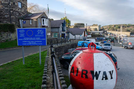 Conwy, Wales, UK : Jan 25, 2020: A bilingual sign at the entrance to Conwy harbour & dock boasts of...