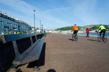 Llandudno, UK : May 6, 2019: A general scenic view of the promenade on North Shore, Llandudno. Very few people are out to enjoy the morning sunshine.のeditorial素材