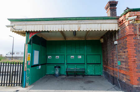 Pensarn, Abergele, UK: Aug 19, 2019: The Abergele and Pensarn railway station has an old fashioned outdoor waiting area.のeditorial素材