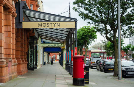 Llandudno, UK: Aug 27, 2019: Glass and cast iron canopied shop and gallery premises on Vaughan Street.のeditorial素材