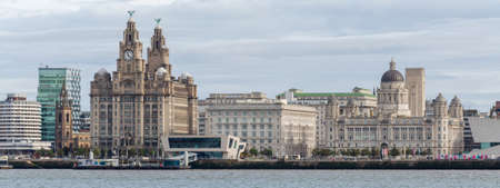 Liverpool, UK: Oct 1, 2017: A general scenic view of the buildings on the Liverpool Waterfont seen from the opposite bank of the River Mersey.のeditorial素材