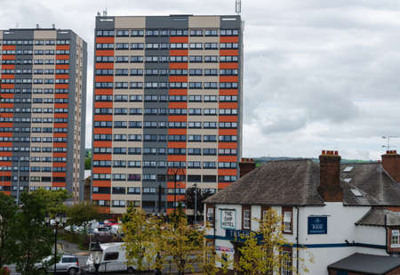 Flint, UK: Sep 12, 2017: A view from the pedestrian footbridge which crosses the railway line in Flint. The Ship Hotel and Richard Heights block of flats are clearly visibleのeditorial素材