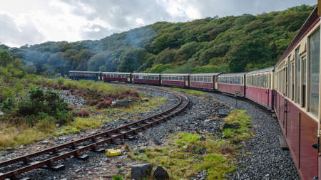 Ffestiniog, North Wales, UK: Sep 14, 2017: A narrow gauge steam train hauls tourist carriages...