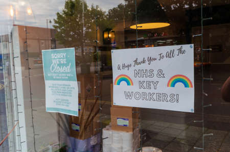 Prestatyn, UK: Jul 06, 2020: A notice in the window of The William Morgan public house gives information to customers whilst the business is closed during the coronavirus pandemic.のeditorial素材