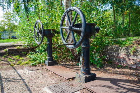 Flint, Flintshire; UK: Sept 17, 2020: Old manually operated sluice gate valves at Flint Dock remain,...