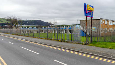 Prestatyn, UK: Mar 19, 2021: A metal fence surrounds the Pontins holiday camp on Barkby Avenue.のeditorial素材