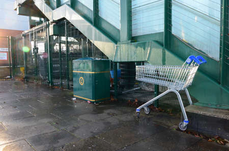 Prestatyn, UK:Dec 14, 2021: A supermarket shopping trolley from a nearby Tesco store has been...