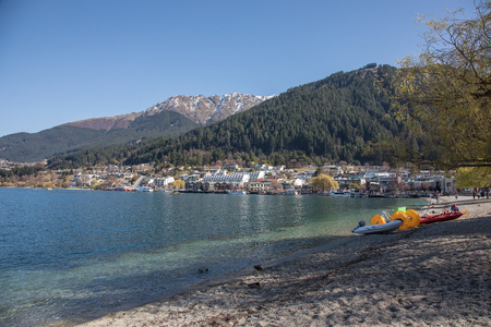 Part of Queenstown, South Island, New Zealand from the beach looking over Lake Wakatipu.のeditorial素材