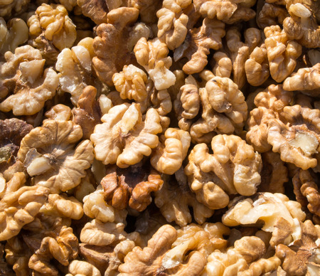 Pile of shelled walnuts  for sale at a market to be used for cakes or cookingの写真素材