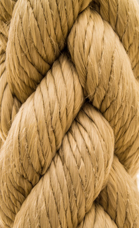 A closeup shot of cream colored rope showing texture and weavingの写真素材