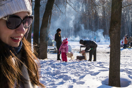UFA/BASHKORTOSTAN RUSSIA - 7th March 2015 - The Russian public enjoying individual shashlik barbecues in the winter snow of an open parkのeditorial素材