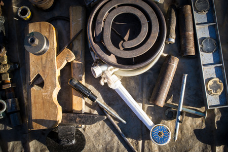 A collection of old unassorted junk including tools and utensils