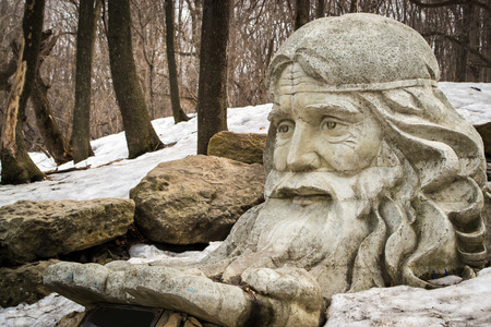 Old stone statue of a bearded manの写真素材