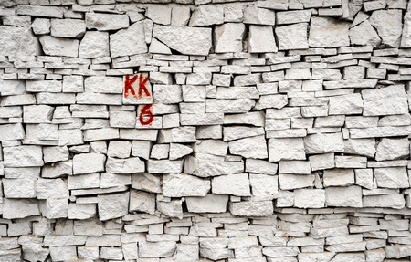 Loose form bricks constructed to provide a secure industrial wall marked by KK6 in Red Inkの写真素材