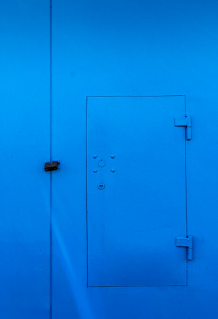 Secure and brightly painted garage door with lockの写真素材