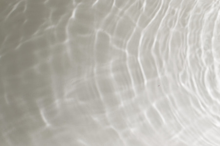 Ripples and small waves on the surface of bath waterの写真素材