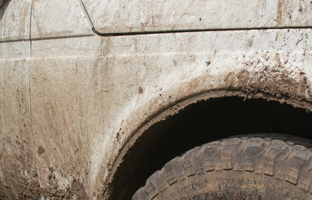 White jip covered in dried mud splashes and dirtの写真素材