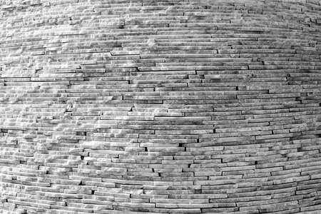 White marble tiles form a circular wall in black and whiteの写真素材
