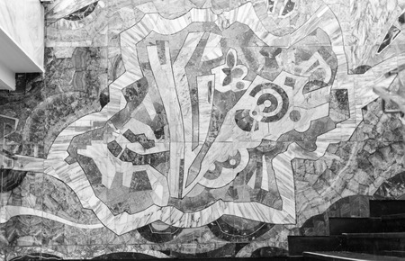 Wall mosaic in abstract style made from tiles