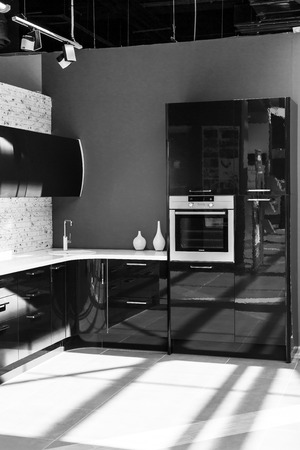Modern urban kitchen units in black and whiteの写真素材