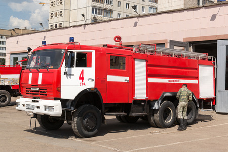 Firemen in Ufa Russian respraying a fire vehicle in the summer heat of May 2015のeditorial素材