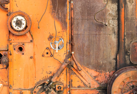 Closeup of rusty cogs and gears of a disused USSR Soviet combine harvesterの写真素材