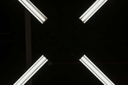 Four overhead lighting units forming an abstract shapeの写真素材