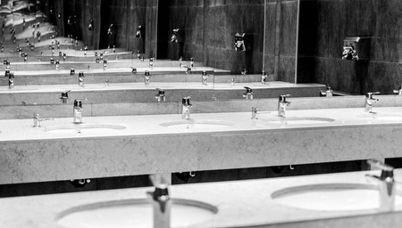 Black and white image of bathroom mirrors reaching into infinityの写真素材