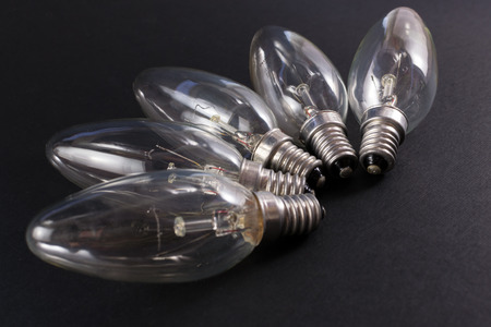 Blown lightbulubs on display on a black background