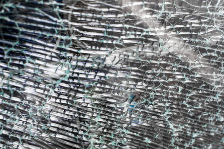 Cracked safety glass in closeup with nobody visible