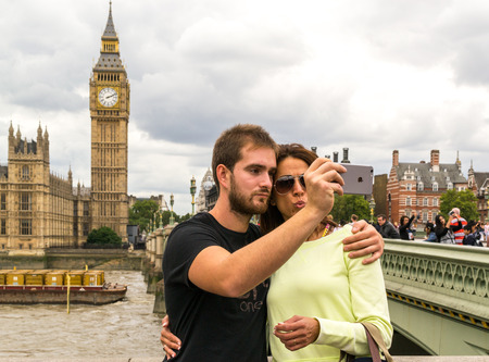 Two young tourists take a selfie photo of Big Ben and the The Houses of Parliamentのeditorial素材