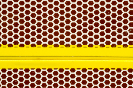Studio macro close up of the texture of a matchbox honeycomb shaped striking surfaceの写真素材