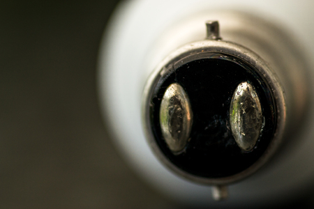 Single macro closeup image of a household home lightbulb with a bayonet endの写真素材